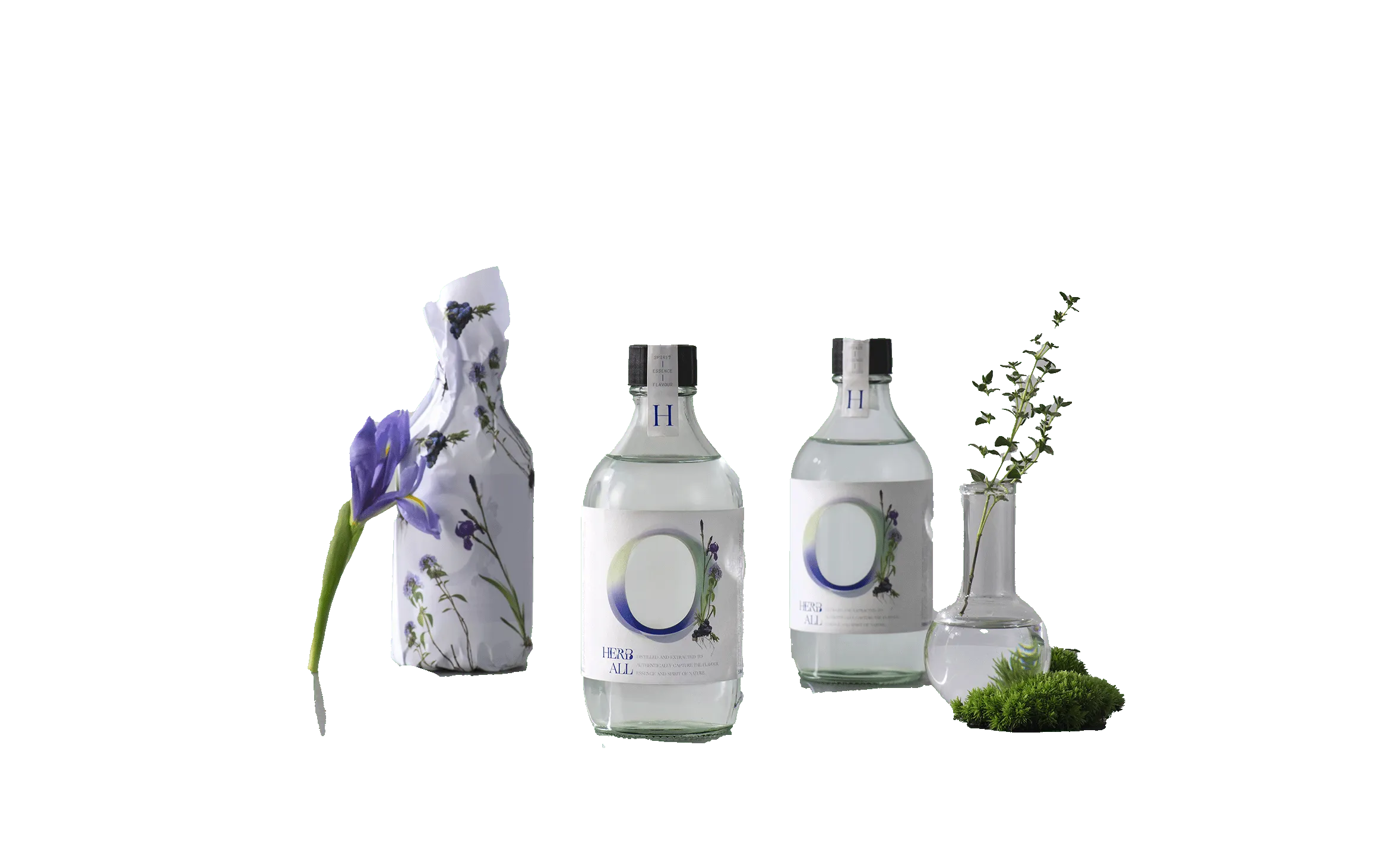 A group of three bottles with flowers in them